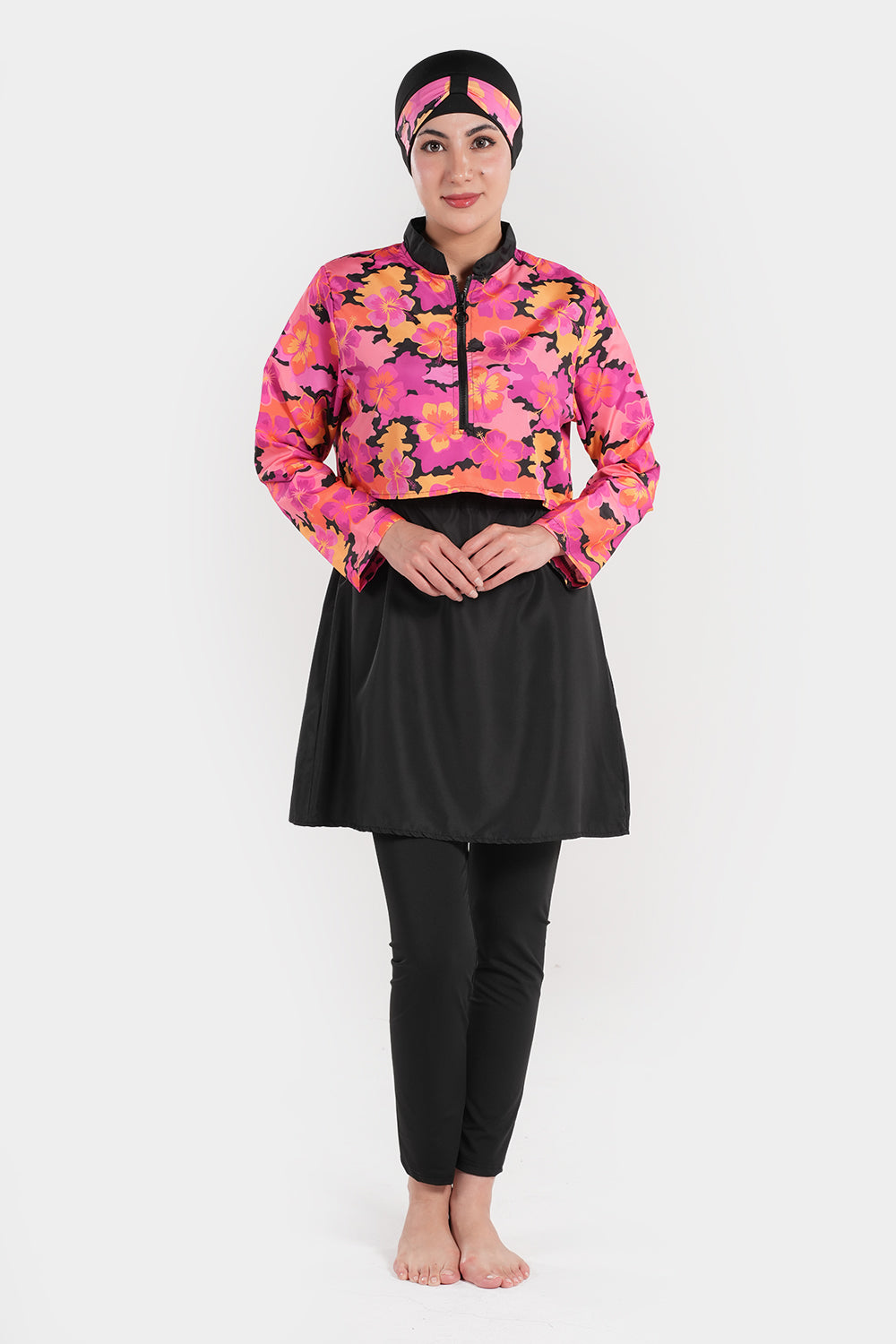 Women’s modest swimwear set with printed top by BAE Modest, featuring a full-coverage swimsuit with colorful floral design.