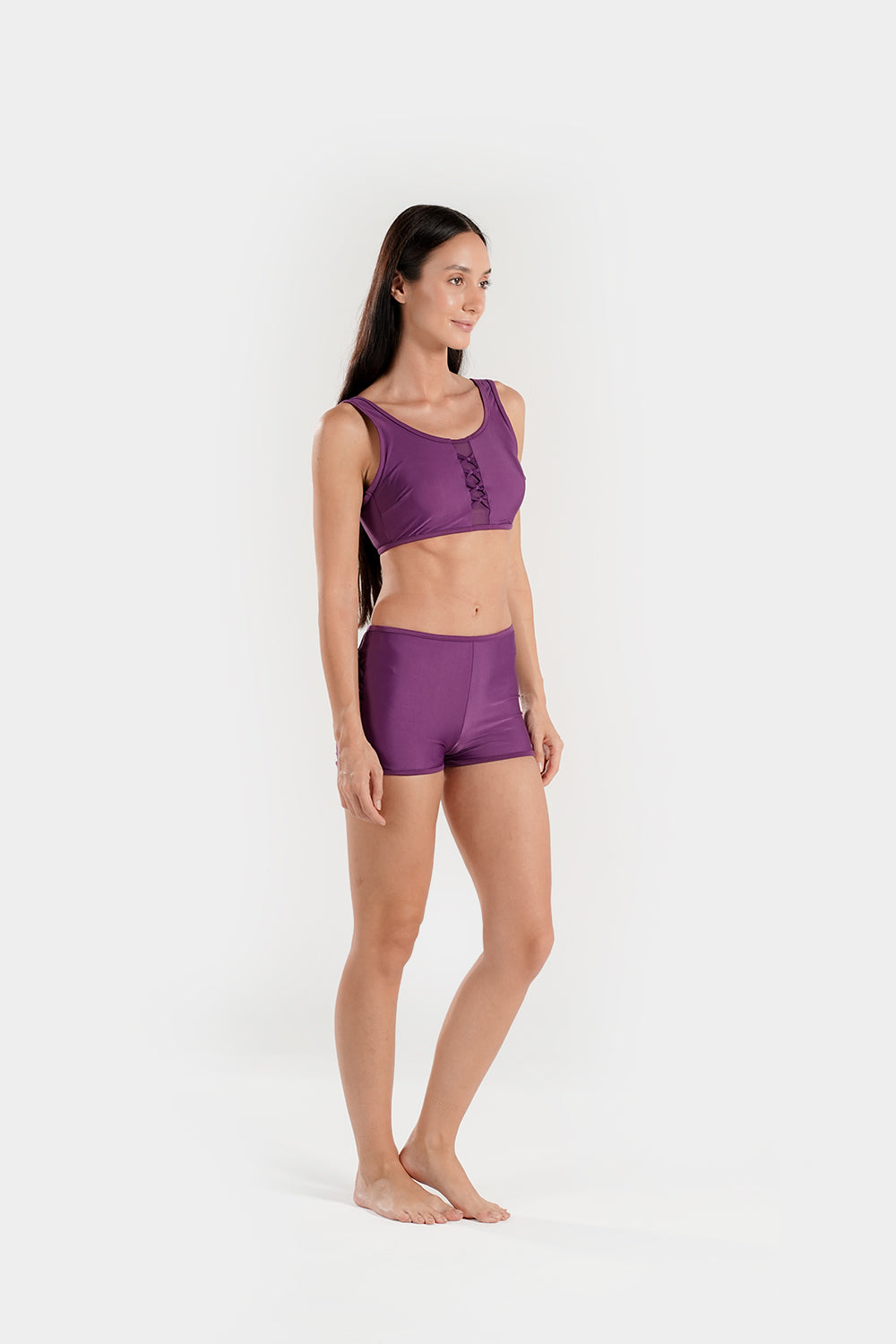 Women’s high-waisted bikini set with lattice mesh detail and sporty shorts by BAE Modest, featuring a stylish two-piece swimsuit design.