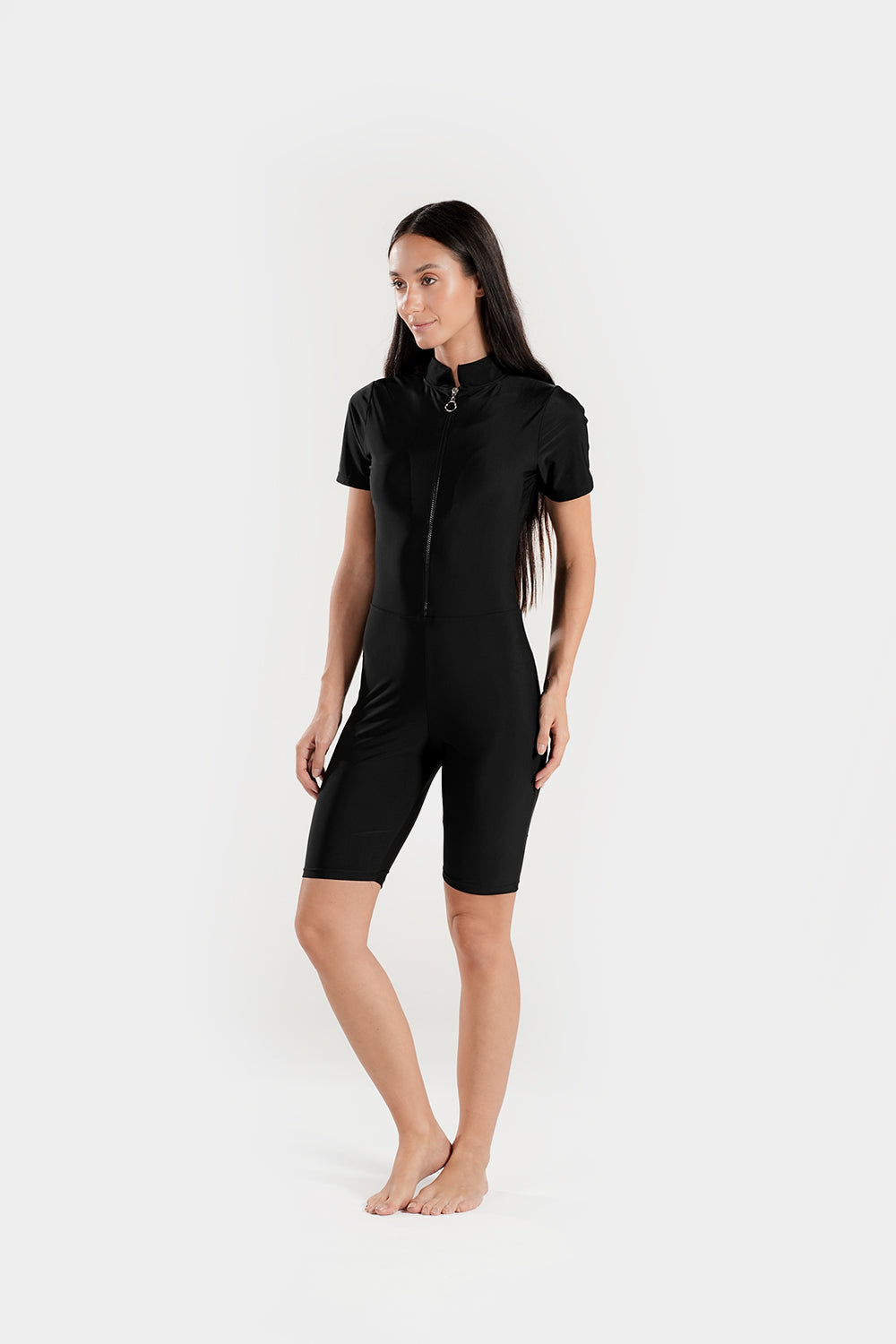 Black BAE Modest one-piece athletic swimsuit with mid-thigh length and half sleeves, designed for active swimming.