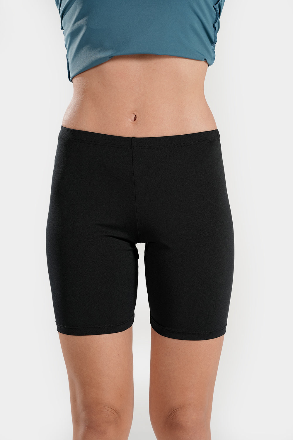 Women’s high waisted modest swim shorts by BAE Modest, quick-drying mid-thigh swimming bottoms with a comfortable fit.