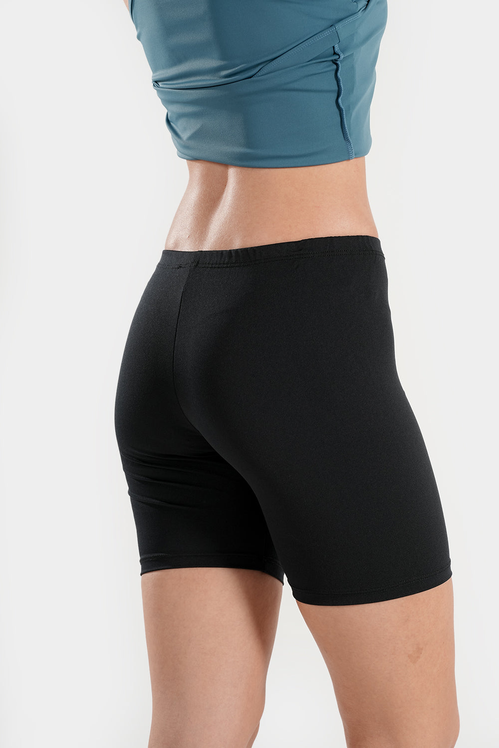 Women’s high-waisted modest swim shorts by BAE Modest, quick-dry mid-thigh swim bottoms for comfortable swimming.