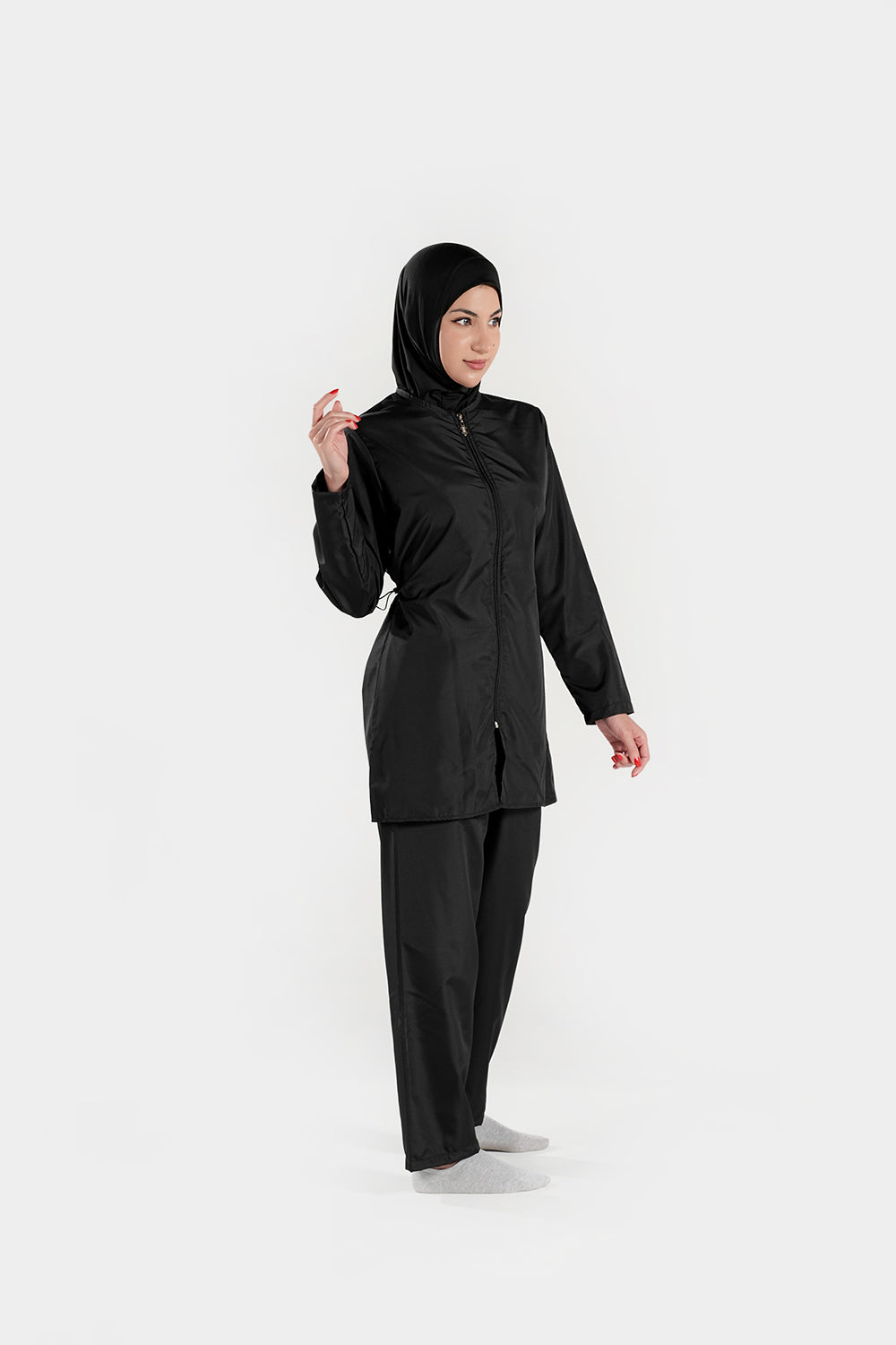 BAE Modest women's mid-length solid color burkini swimwear with full sleeves and hijab, designed for modest coverage in the water.