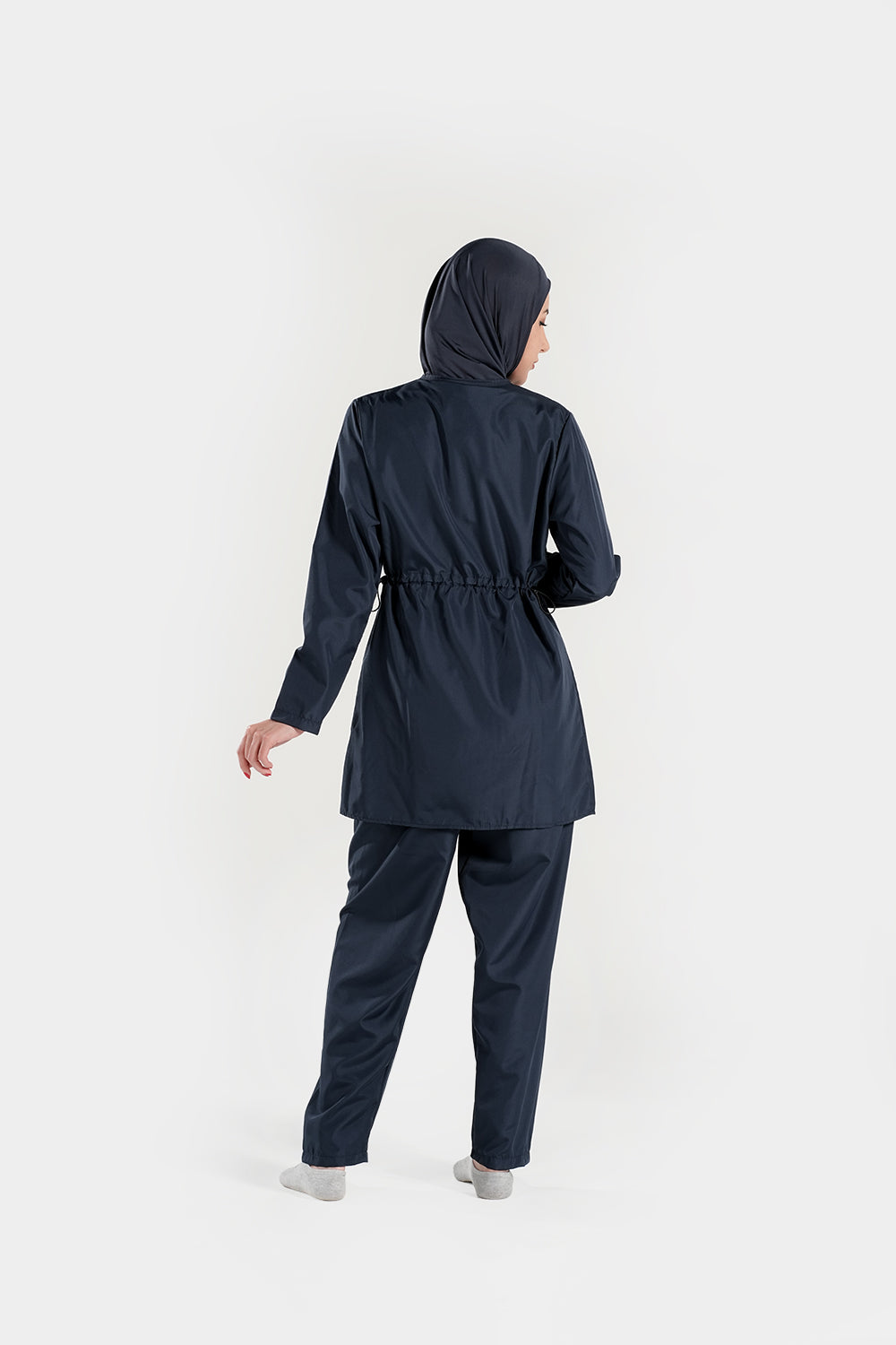 BAE Modest women's mid-length solid color burkini with full sleeves and hijab, designed for modest swimwear, shown on model.