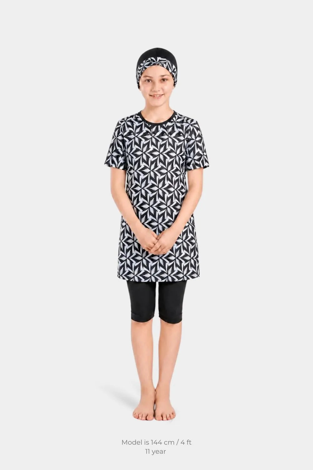 Girls' monochrome leaf print swimwear by BAE Modest, featuring a stylish lycra swimsuit with leaf pattern for girls.