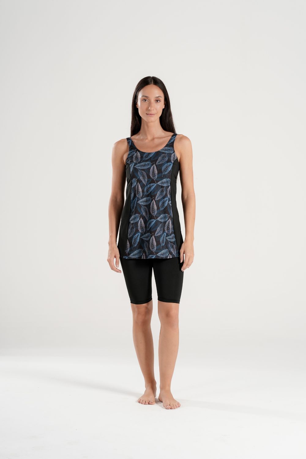 Two-piece BAE Modest leaf print swimsuit with matching knee-length shorts, featuring a vibrant green and white tropical design.