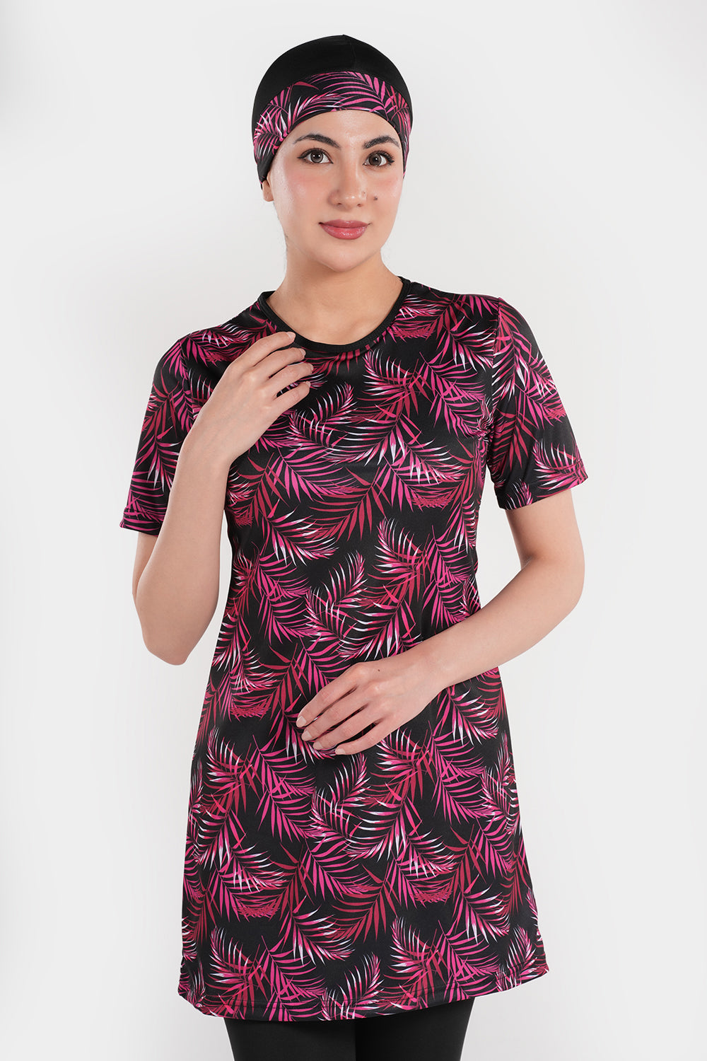 Women’s leaf printed short-sleeve swimwear by BAE Modest, featuring a stylish leafy pattern and comfortable fit.