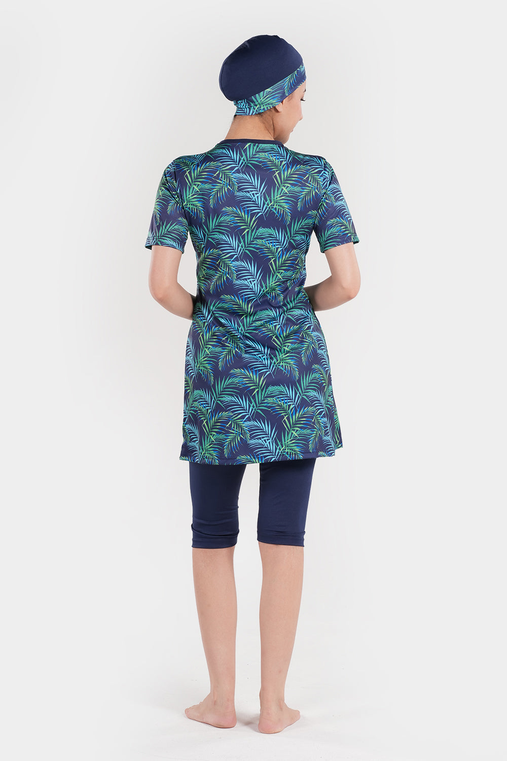 Women’s leaf printed short-sleeve swimwear by BAE Modest with a stylish, colorful leaf pattern on lightweight fabric.
