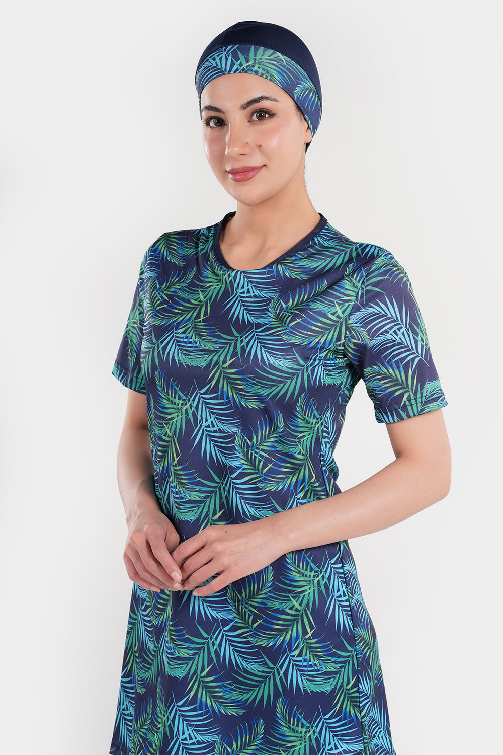 Women’s leaf printed short-sleeve swimwear by BAE Modest, featuring a stylish floral pattern and comfortable fit.