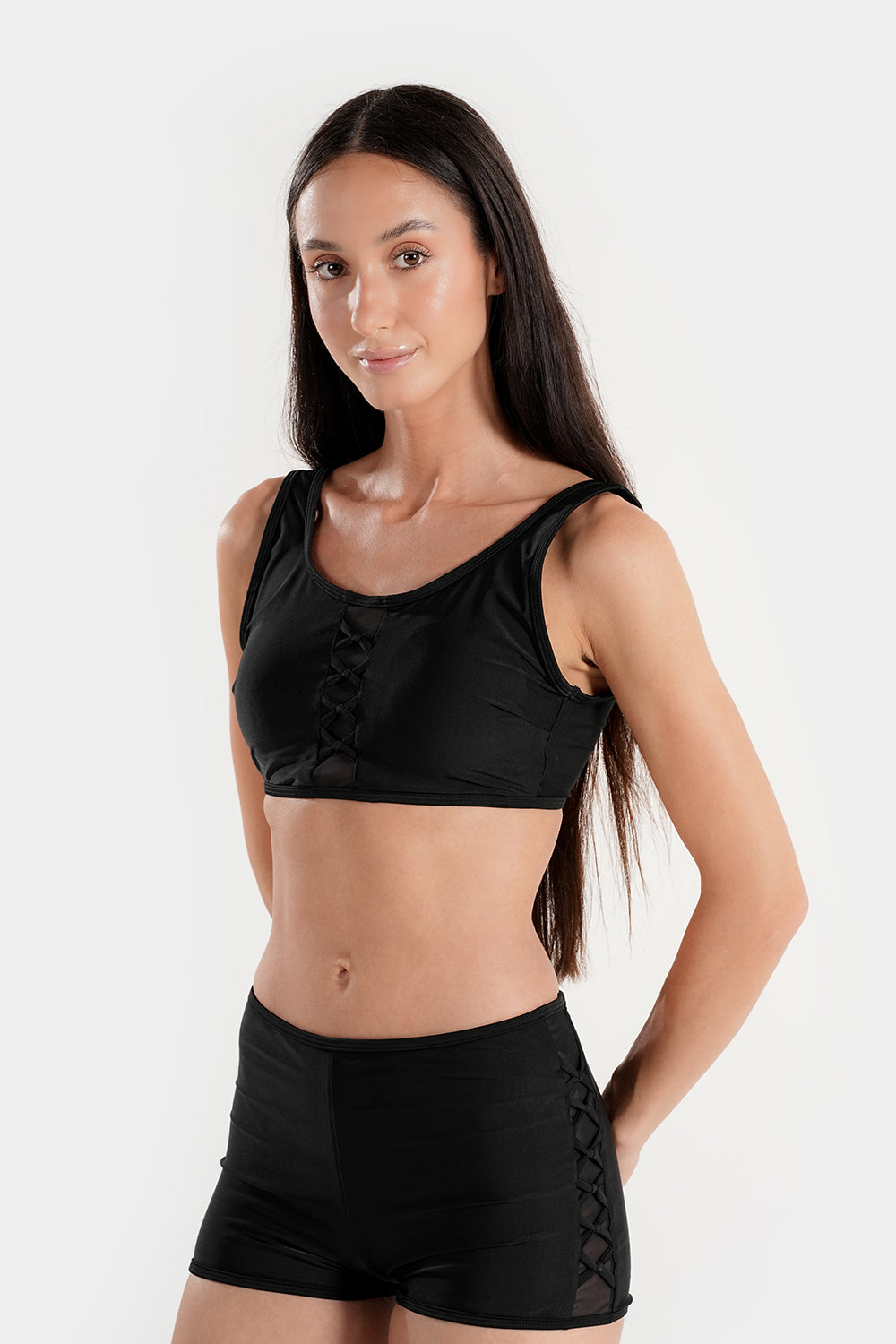 Women’s high-waisted bikini set with lattice mesh detail and sporty shorts from BAE Modest, featuring a stylish two-piece swimwear design.
