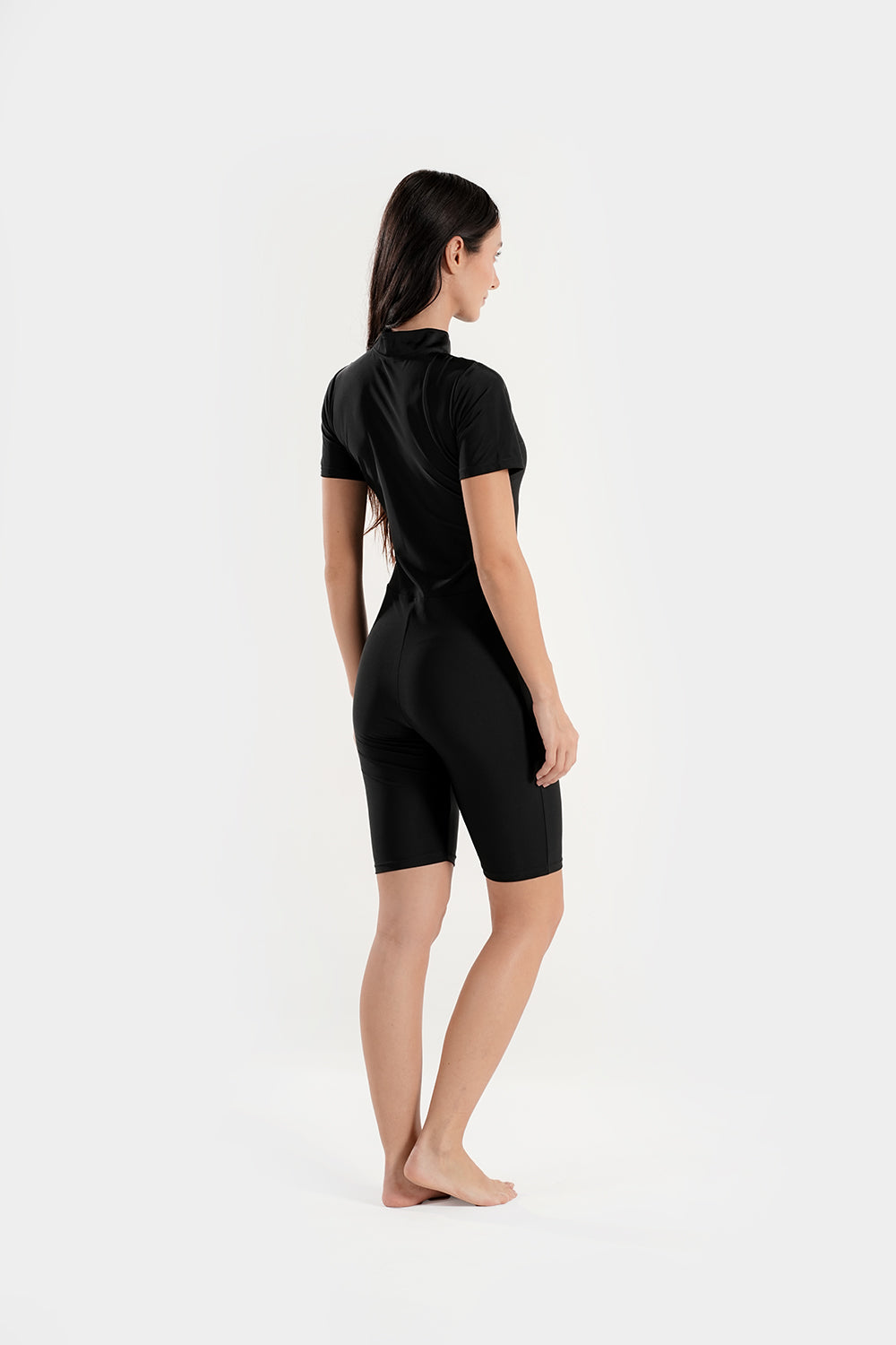 Black BAE Modest one-piece athletic swimsuit with mid-thigh length and half sleeves, designed for swimming and active wear.