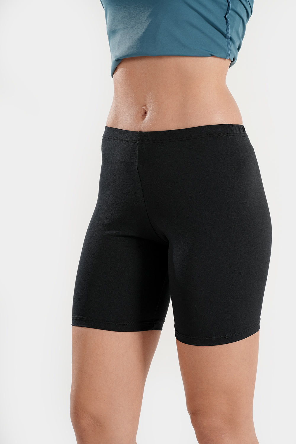 Women’s high-waisted modest swim shorts by BAE Modest, quick-dry mid-thigh swimming bottoms, suitable for comfortable swimming.